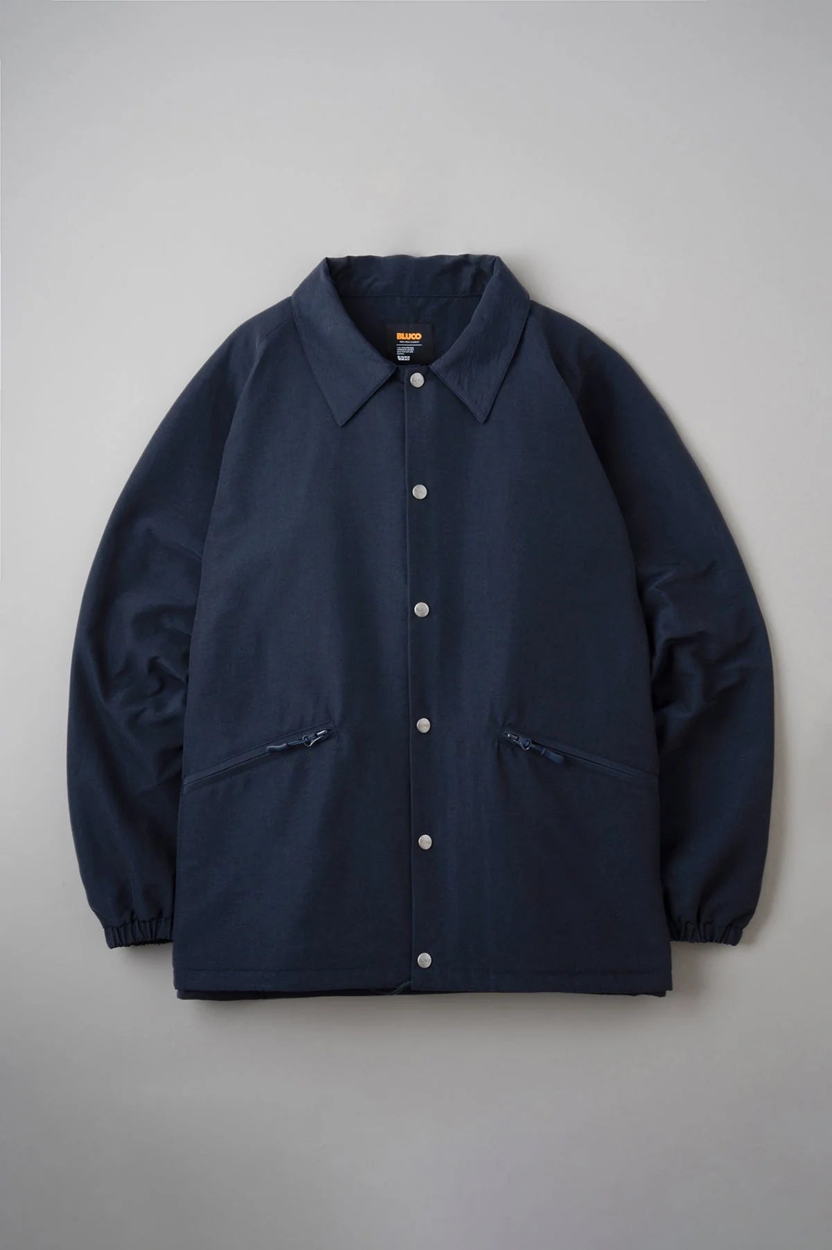 BLUCO/ブルコ】60/40 CHIN STRAP COACH JACKET – Stroke Clothing BLUCO/ブルコ】60/40 CHIN STRAP COACH JACKET – Stroke Clothing